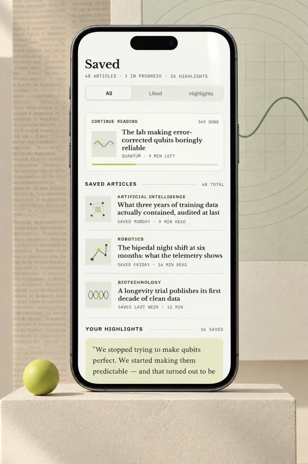 Saved: continue reading, saved articles and highlights, on a phone on a plinth beside a chartreuse sphere